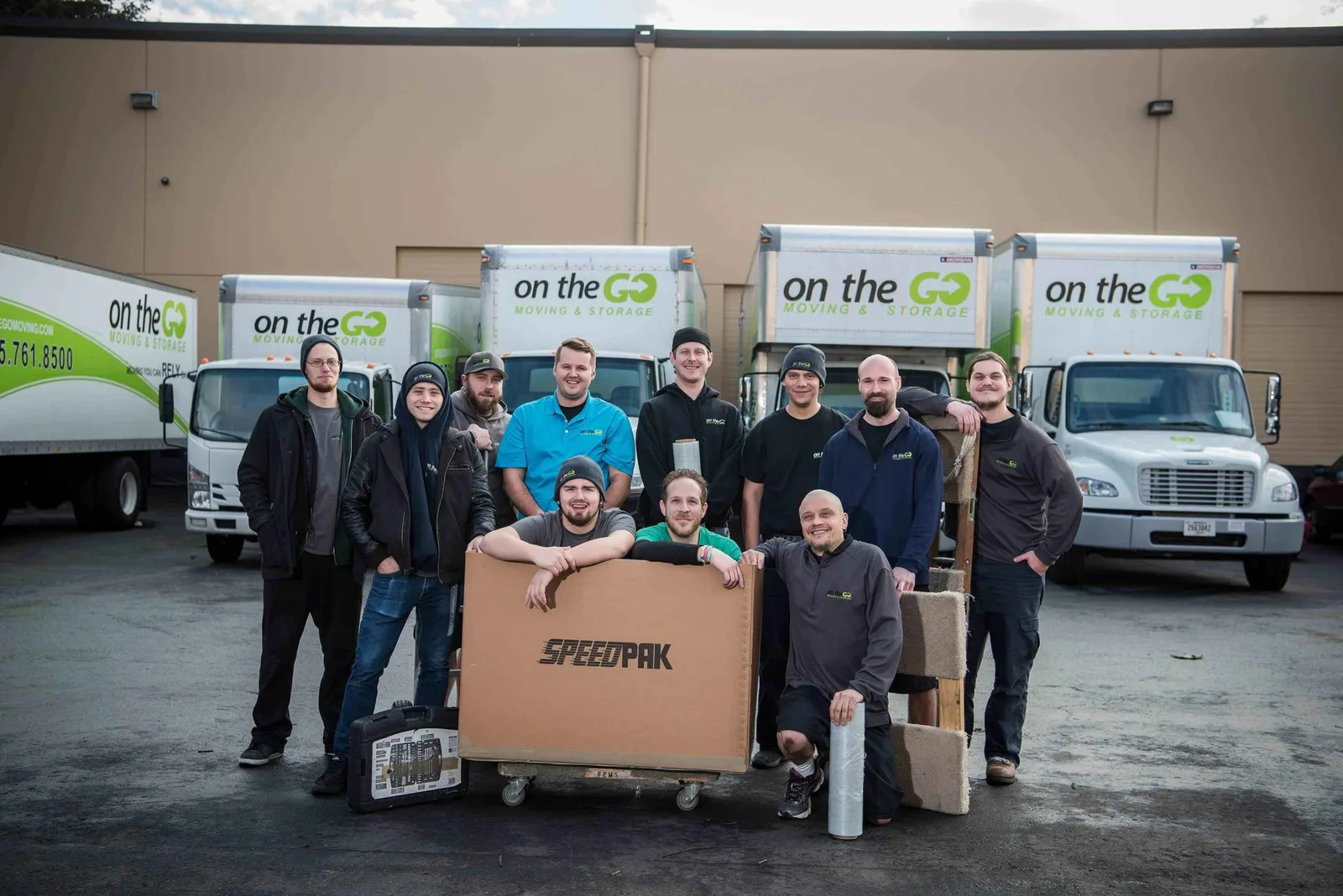 On The Go Moving team in front of moving truck